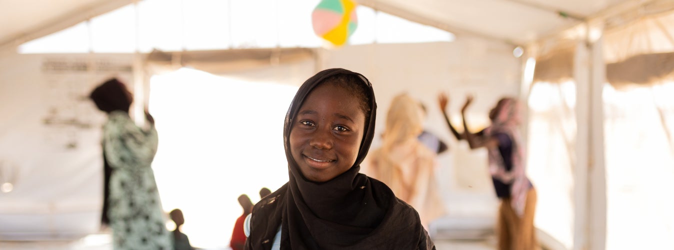 13-year-old Nada stands inside the child-friendly space established by UNICEF in Sudan.