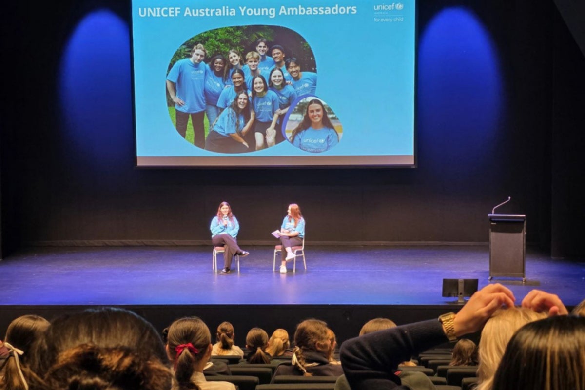 UNICEF Australia Young Ambassador Sian speaks on stage at the Women in Sport Summit Student Day.