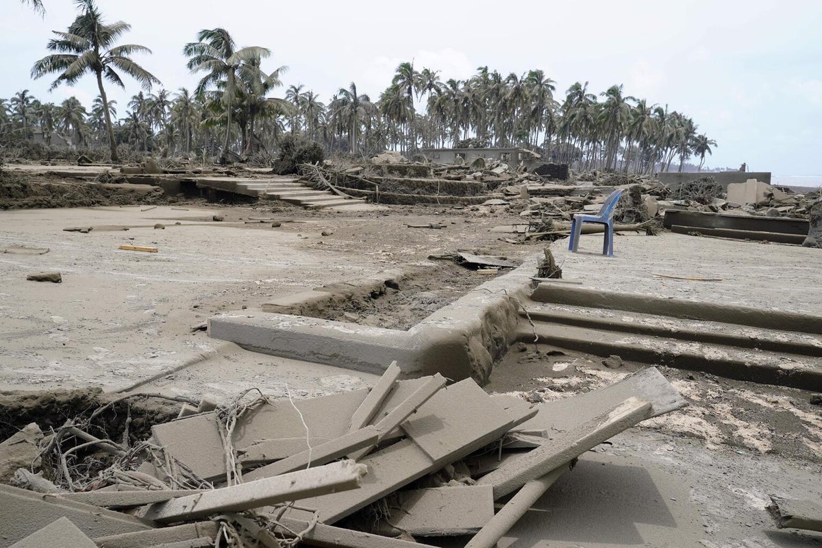 The remains of a beach resort. It all looks muddy.