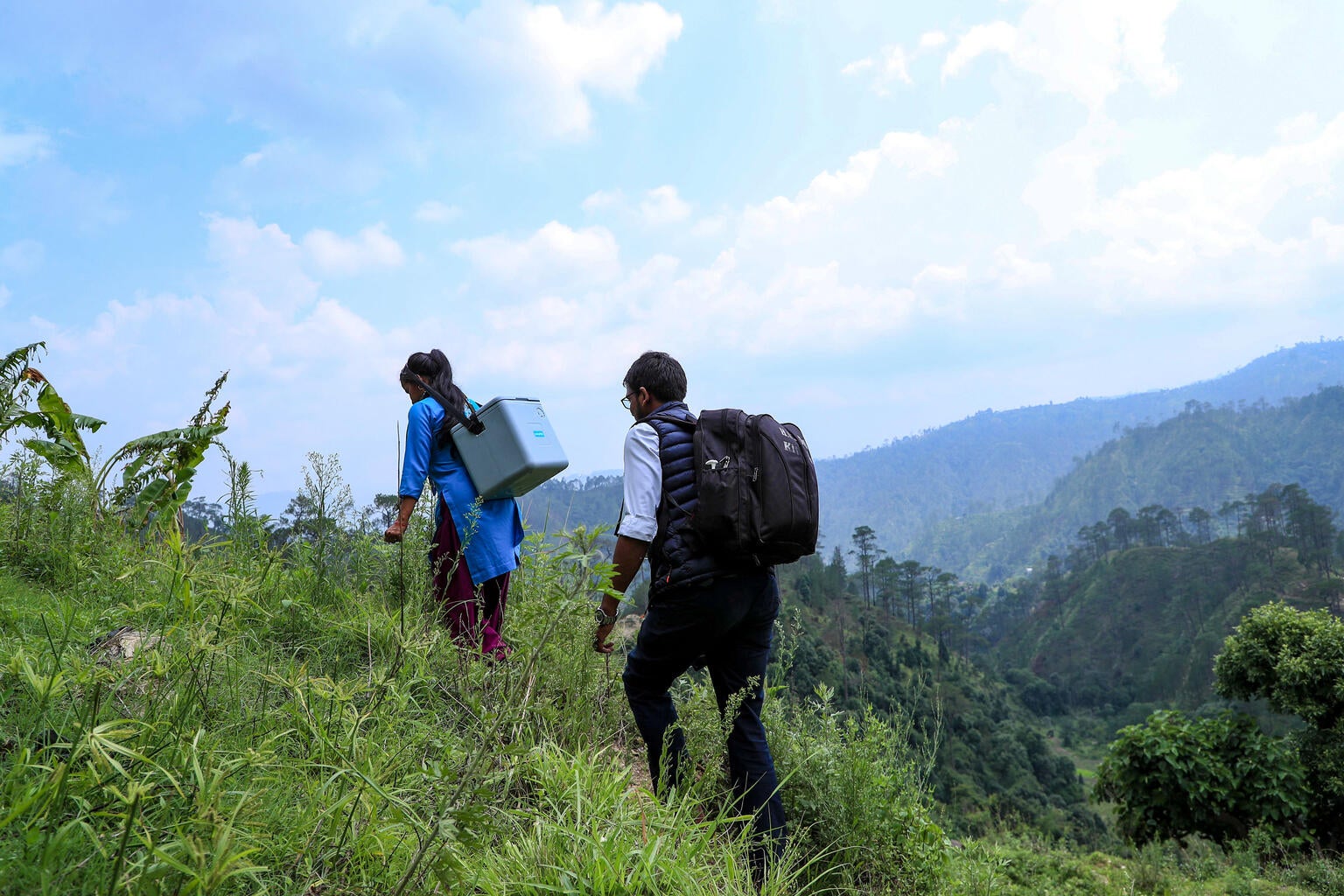 Health workers en route to a community outreach session to vaccinate children under the routine vaccination program in Nepal.