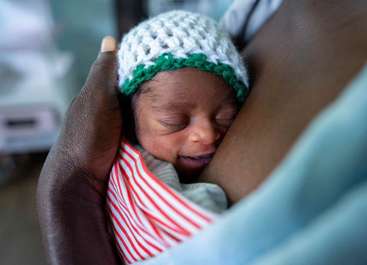 Baby Tamara wrapped safe in her mother’s Kangaroo pouch