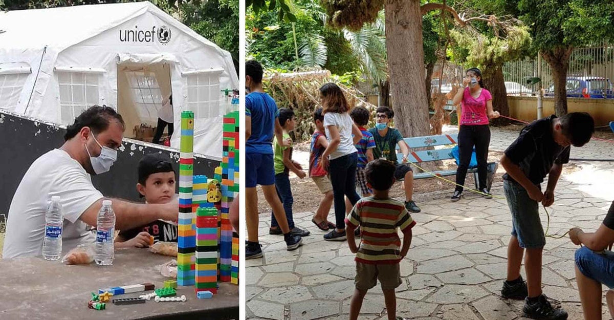 Children play games out the front of a UNICEF tent. 