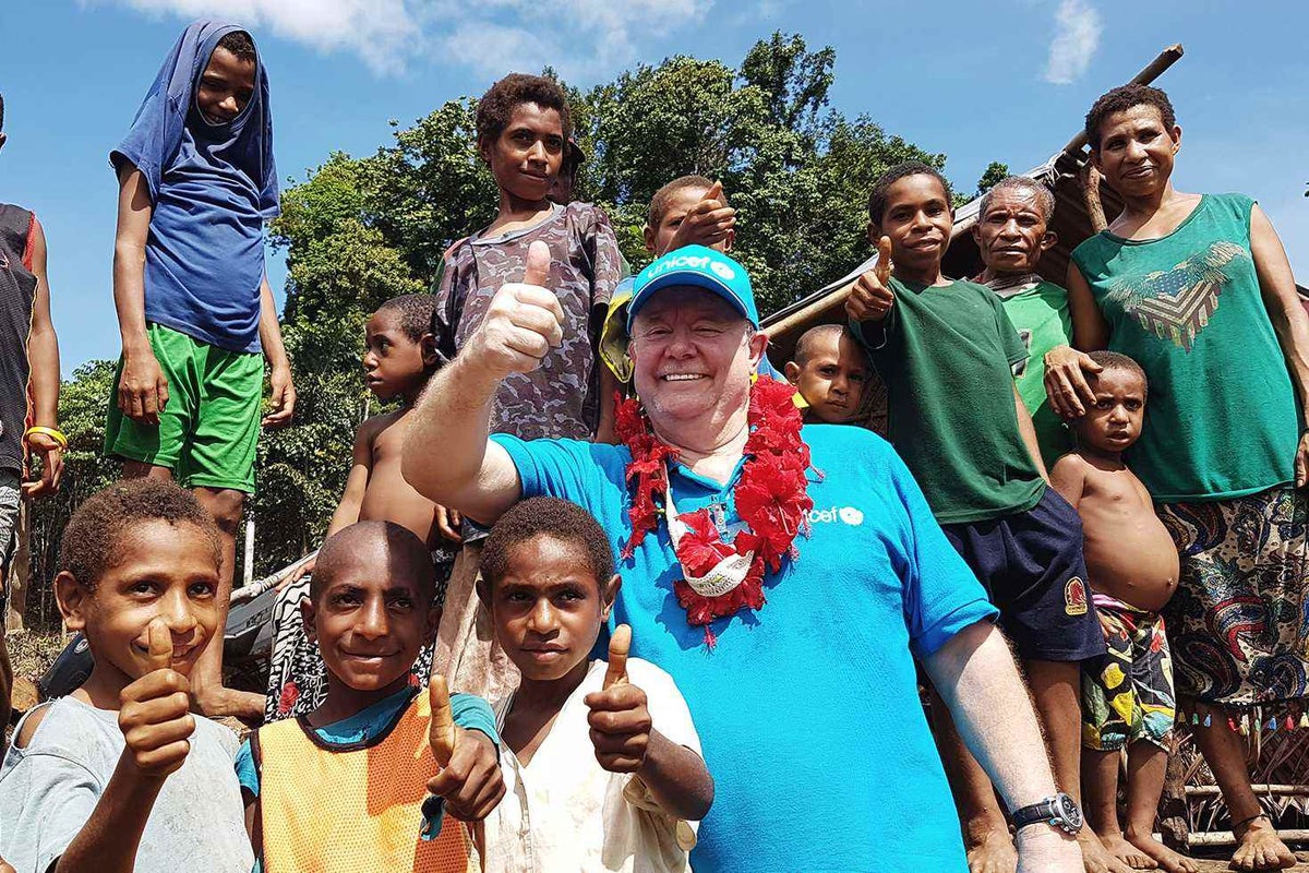 David with children in PNG