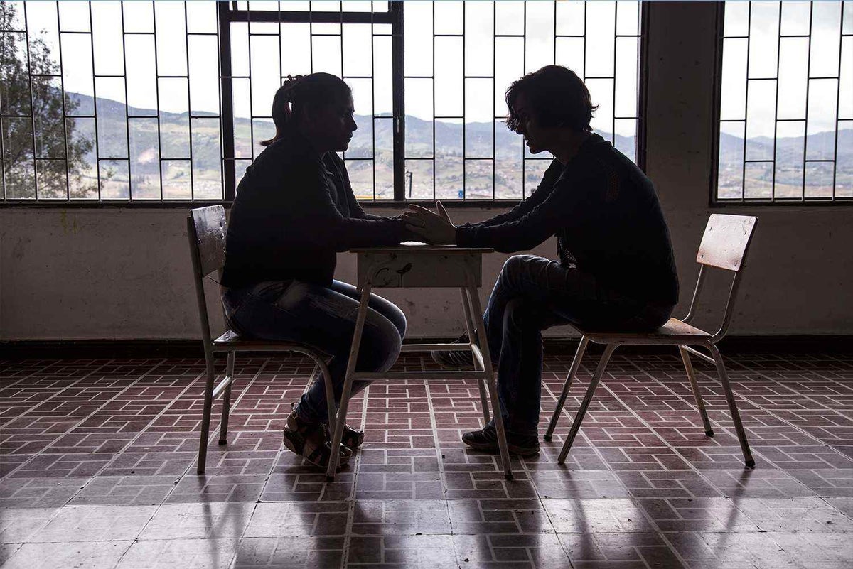 Silhouette of Angelina who speaks to UNICEF about her experiences in an armed group