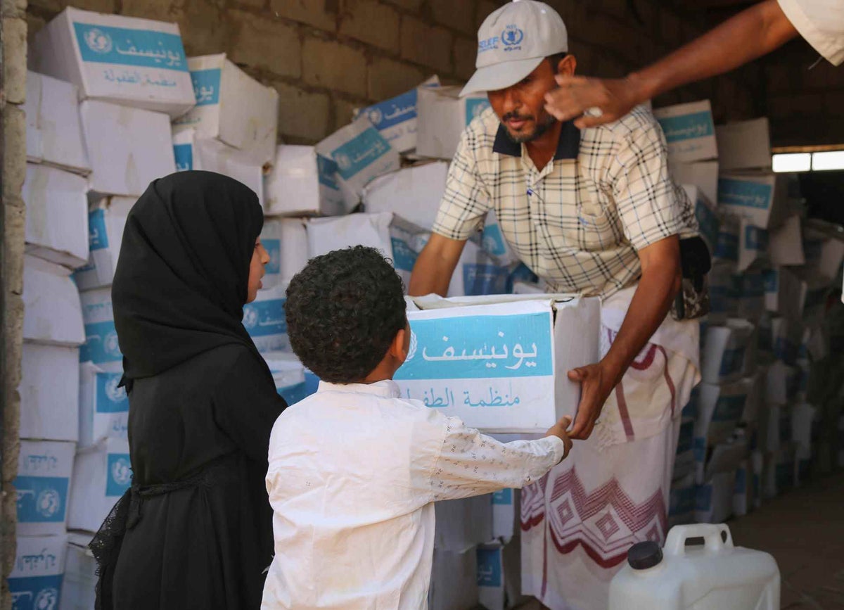 Siham, 9, and her little brother, receives health supplies in Yemen