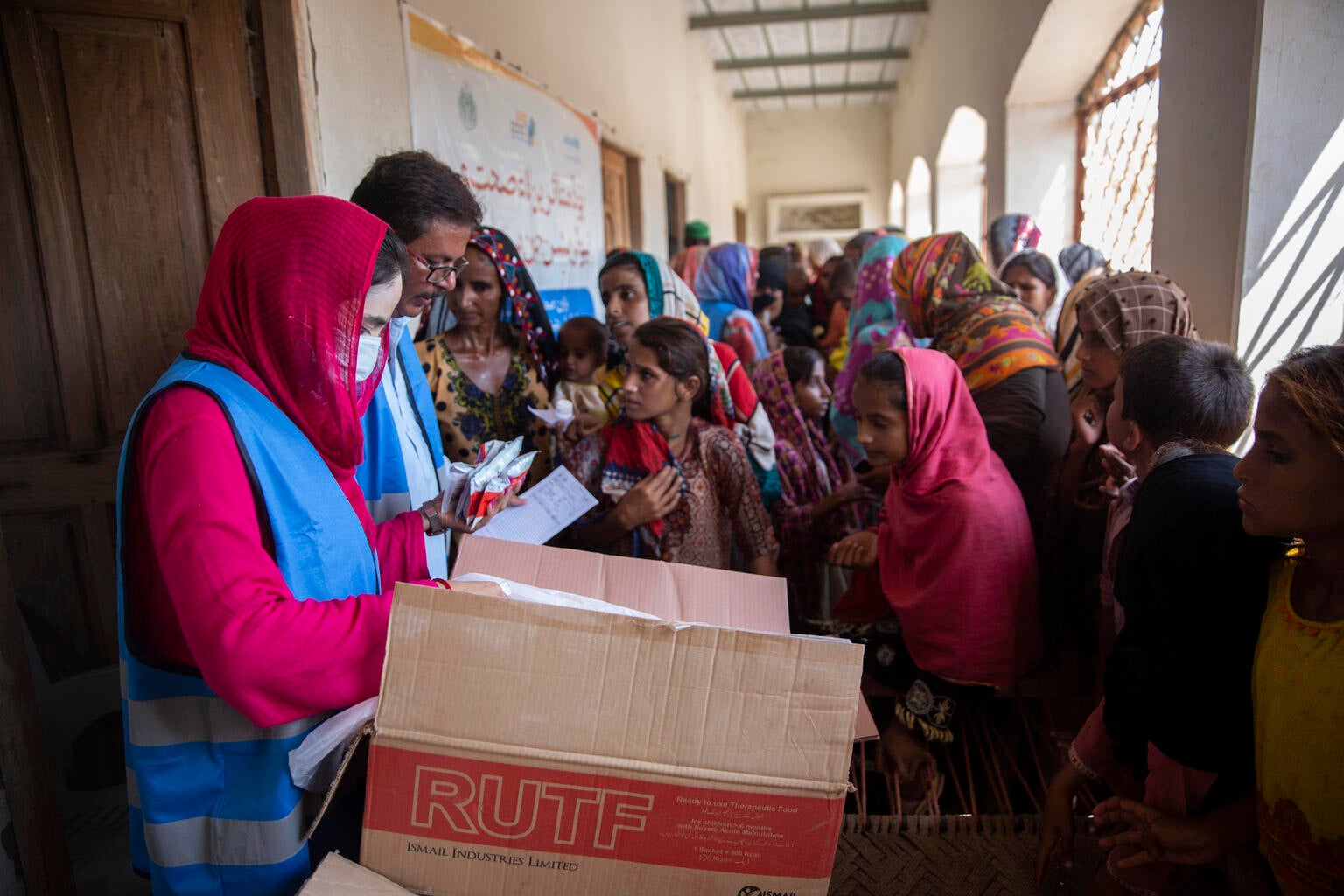 UNICEF workers handing out life-saving supplies to mothers in Pakistan