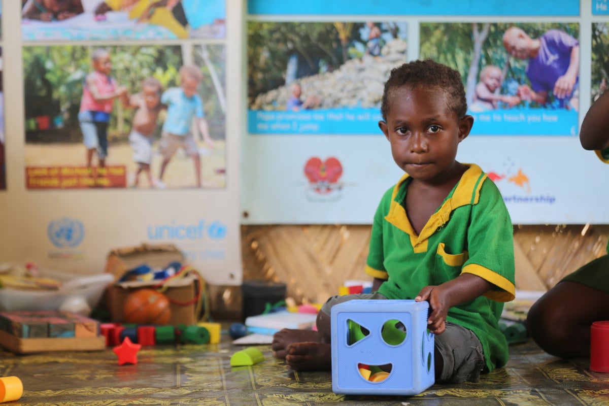 A little boy attending pre-school in rural Papua New Guinea (PNG).