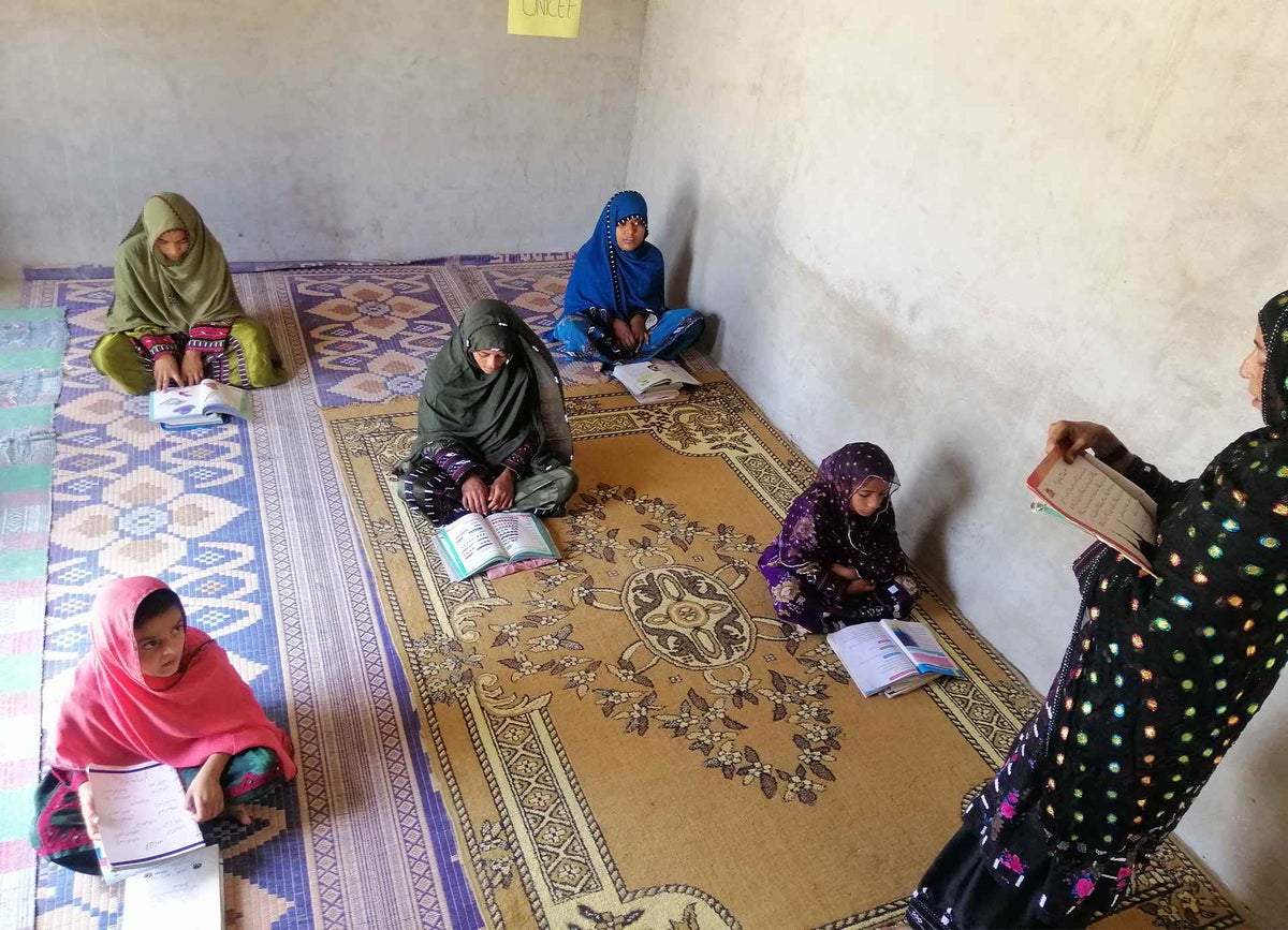 Najeeba teaches children at her home in Pakistan.