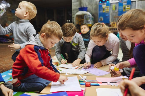 In Ukraine, 2022, children draw and make postcards in the Kharkiv metro. UNICEF equipped the metro station in Kharkiv with learning materials for art, play, and reading. This is one of the few entertainments available to them now during the continuous shelling of their war-torn city. 