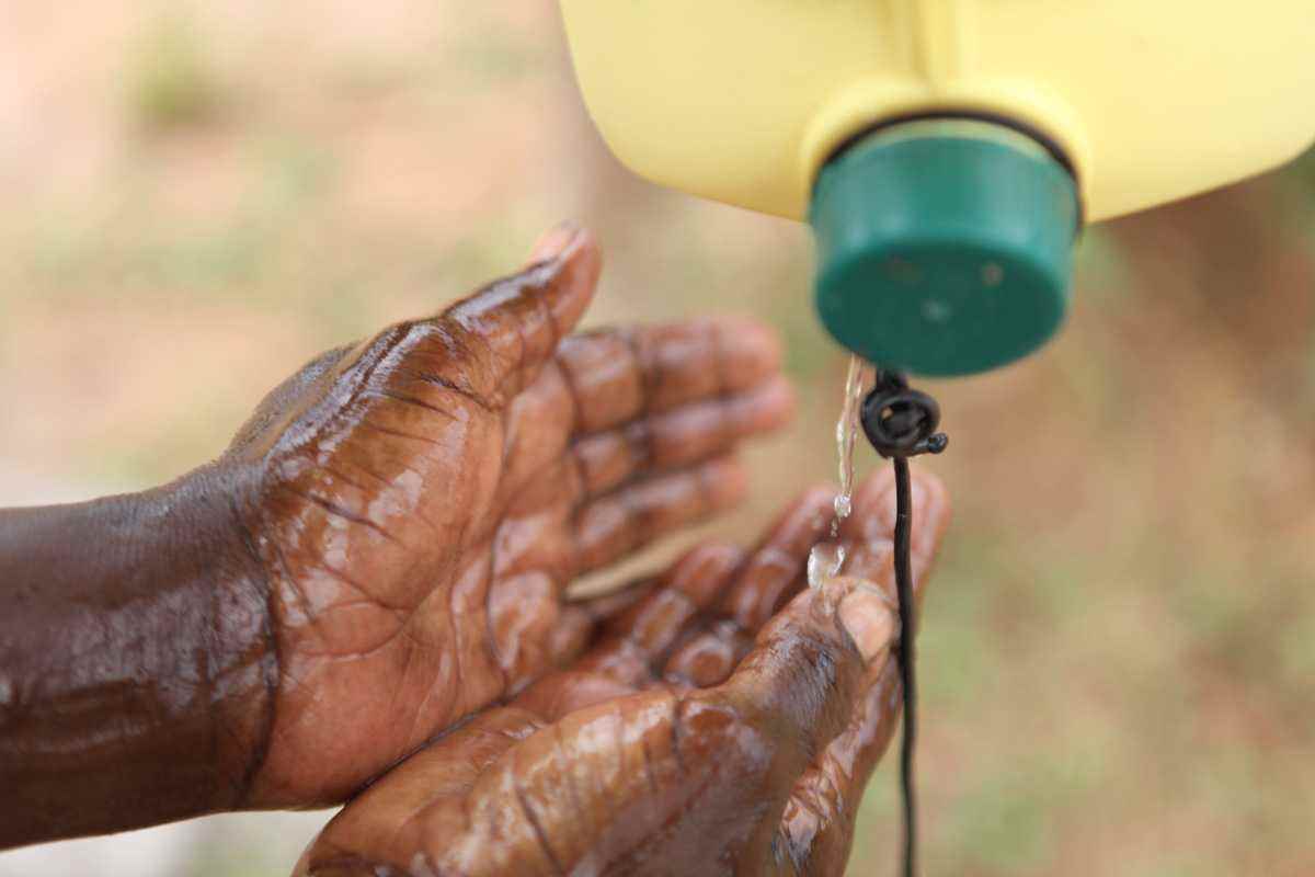 'Tippy taps' are a simple but effective way to maintain hygiene without running water.  A foot lever keeps the process hands-free and avoids the transmission of bacteria