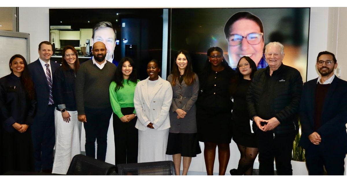A group photo of attendees of an interfaith roundtable discussion Princess (fourth from right) attended. 