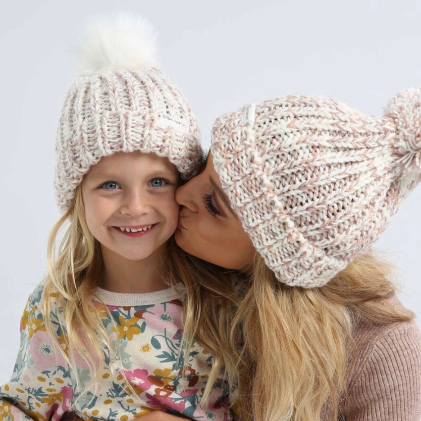 Carrie Bickmore and daughter Evie wearing beanies