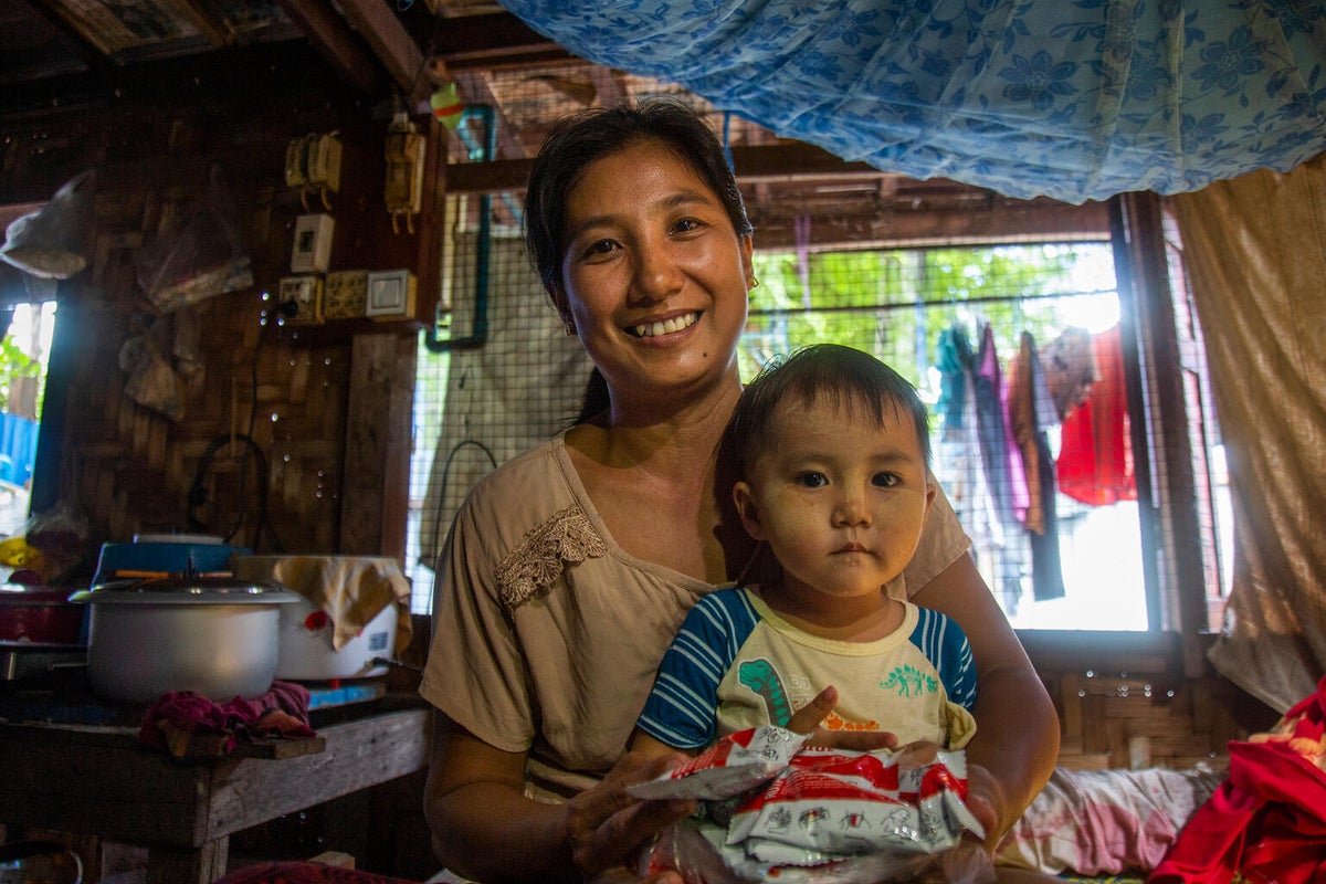 Nyein with her two-year-old daughter, Shi, at their home in Myanmar.