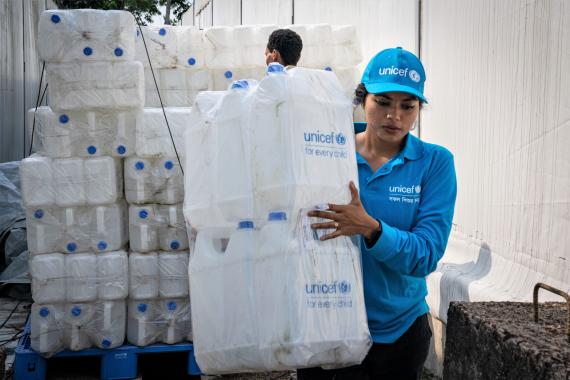 A worker preparing supplies at the UNICEF warehouse.