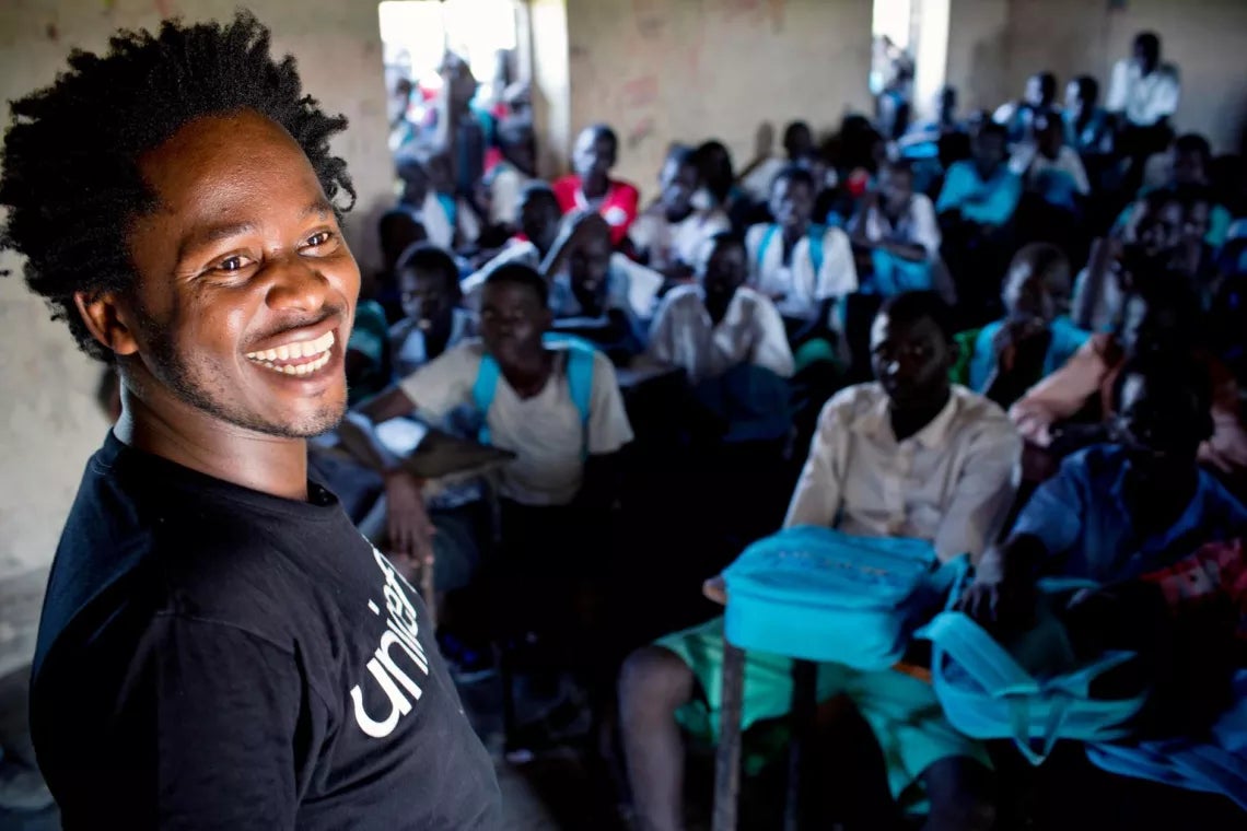 Ishmael Beah meets children at a UNICEF-supported school in South Sudan.
