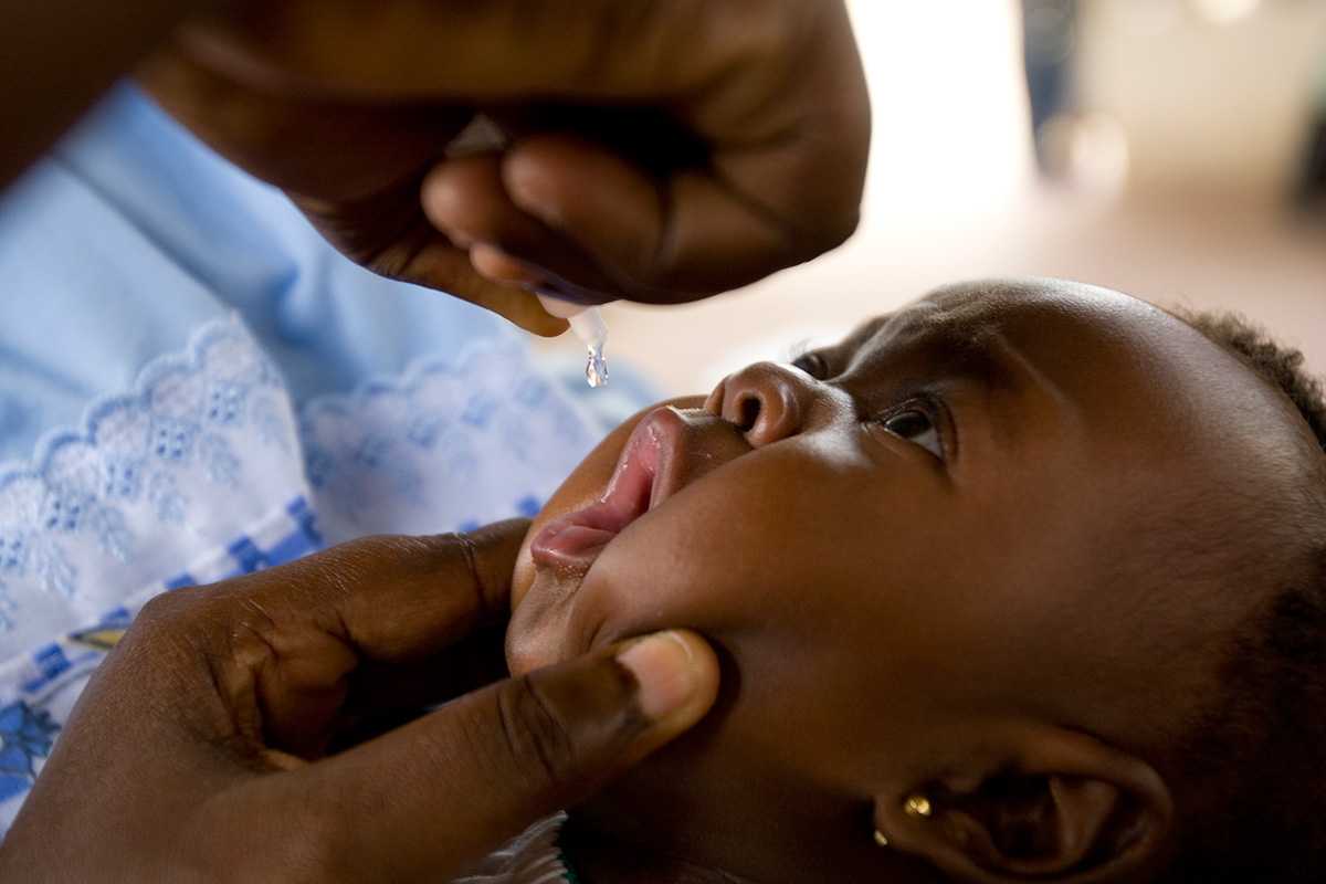 Child receiving oral vaccine