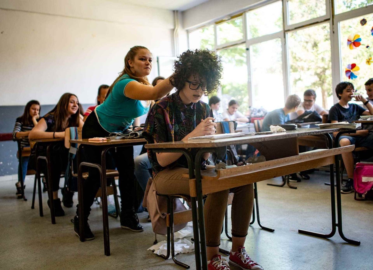 Peer mediators simulate a case of bullying at a school in Kosovo.