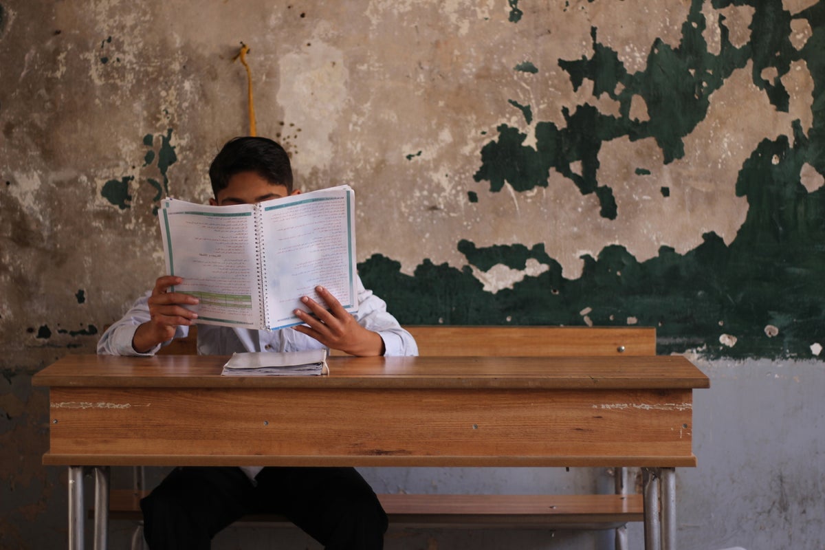 Syrian boy studying
