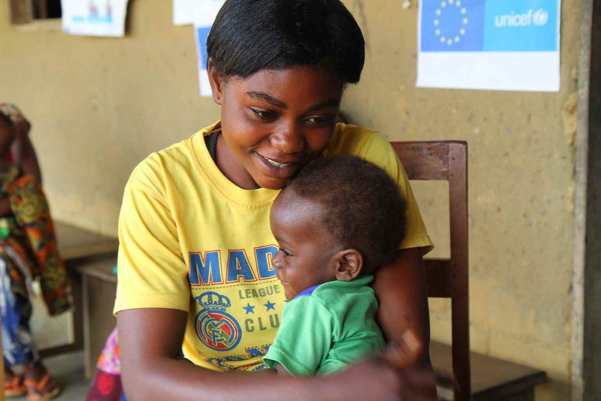 Dada Furaha sits with her young son Jean Marie at a health centre in the Democratic Republic of the Congo in 2015. He is being treated for severe acute malnutrition.  