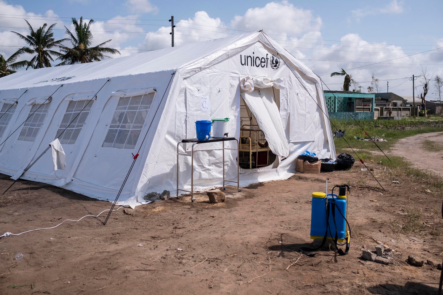An aid tent with the UNICEF logo on it.