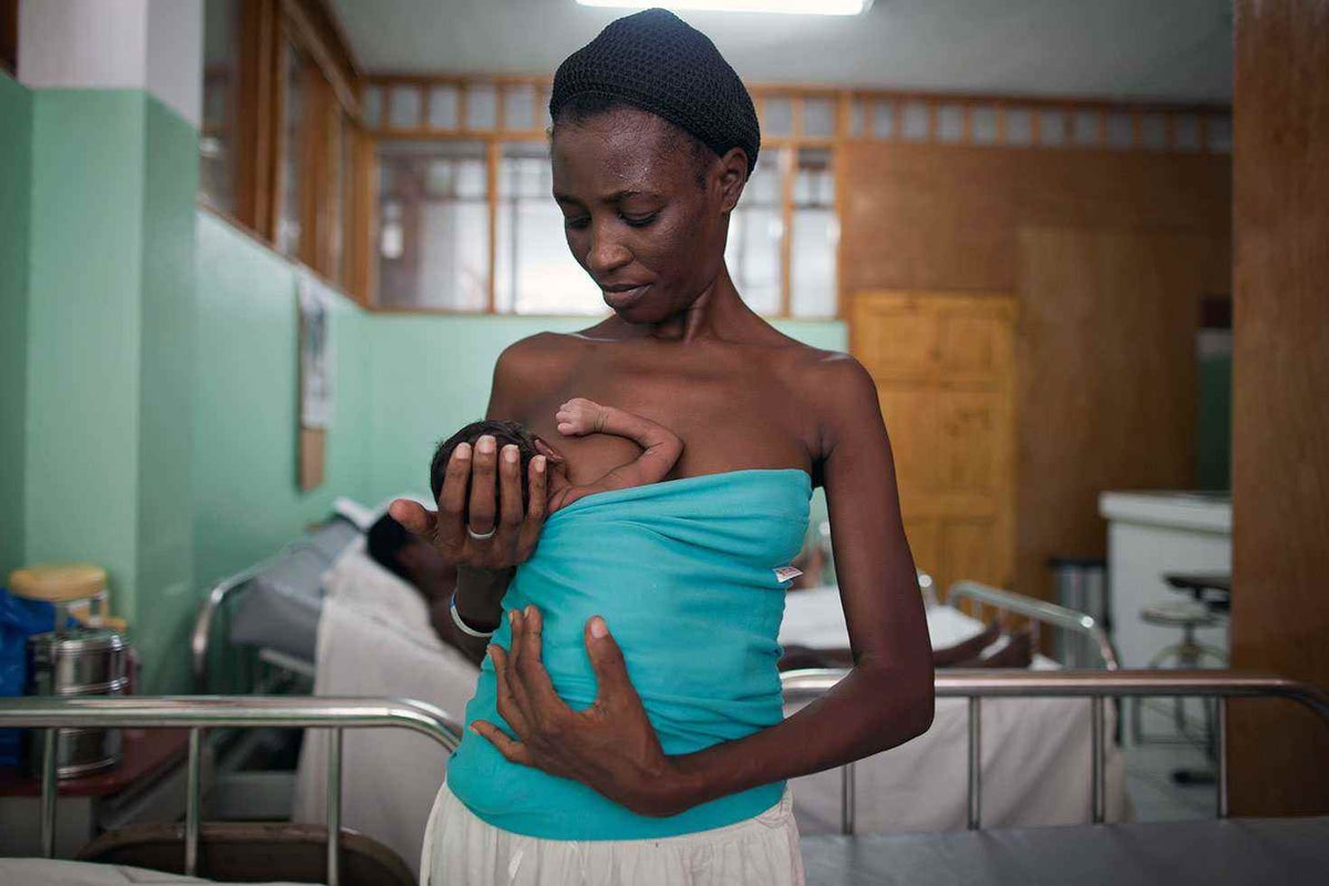 Marie Michelle holds her baby close. It’s called ‘kangaroo care’ - a simple but life-saving innovation in newborn health