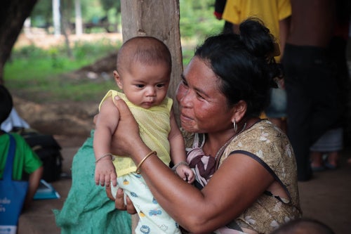 A mother smiles at her baby at a parenting session in Lao PDR.