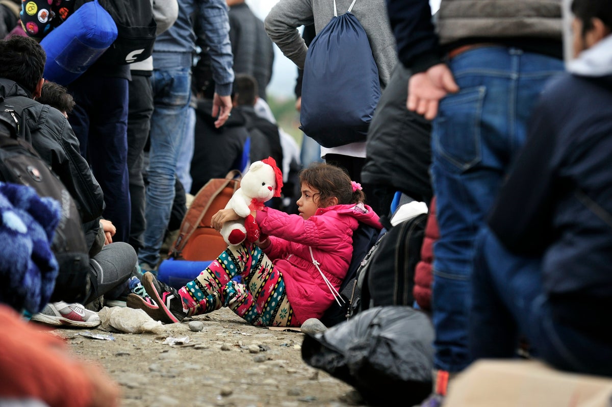 Girl sits in a crowd