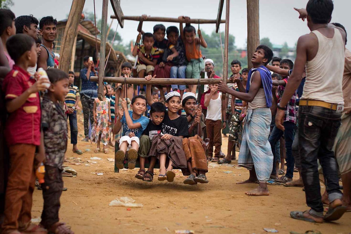 Children enjoy a home-made ferris wheel in the Rohingya refugee camps in Bangladesh.