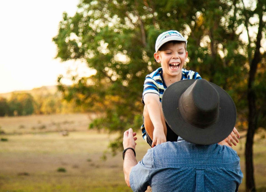 A child jumping into the arms of his dad