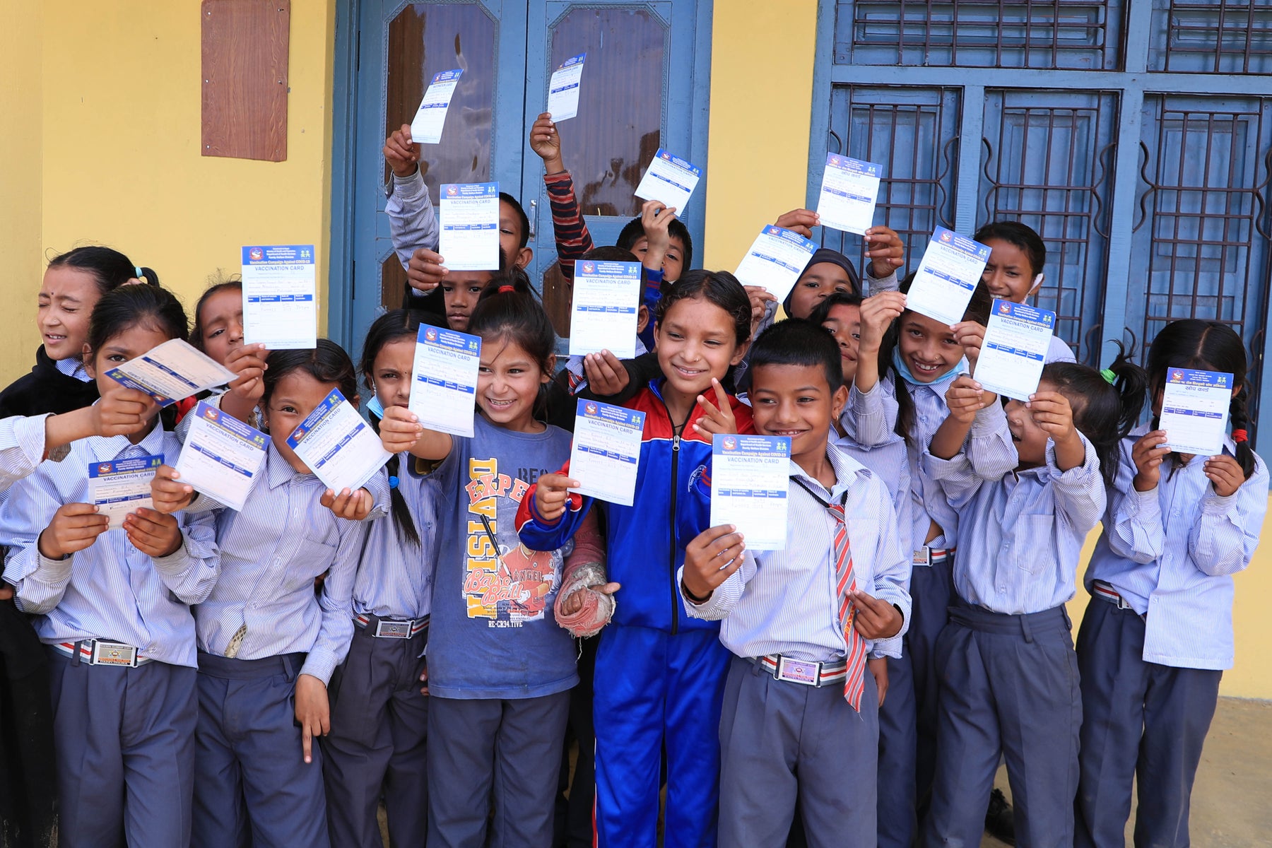 Children with their vaccination certificates