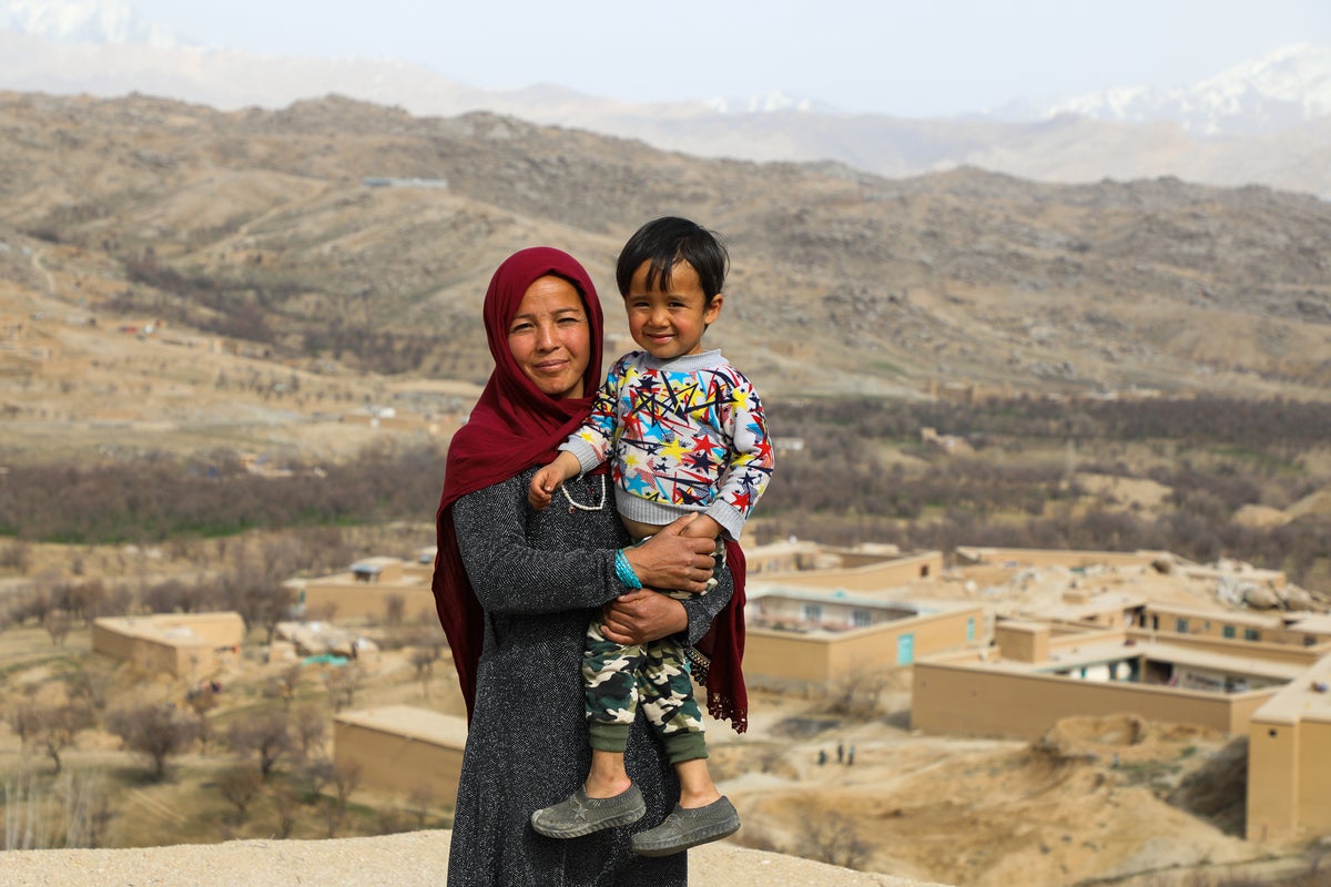 A teacher standing with her child