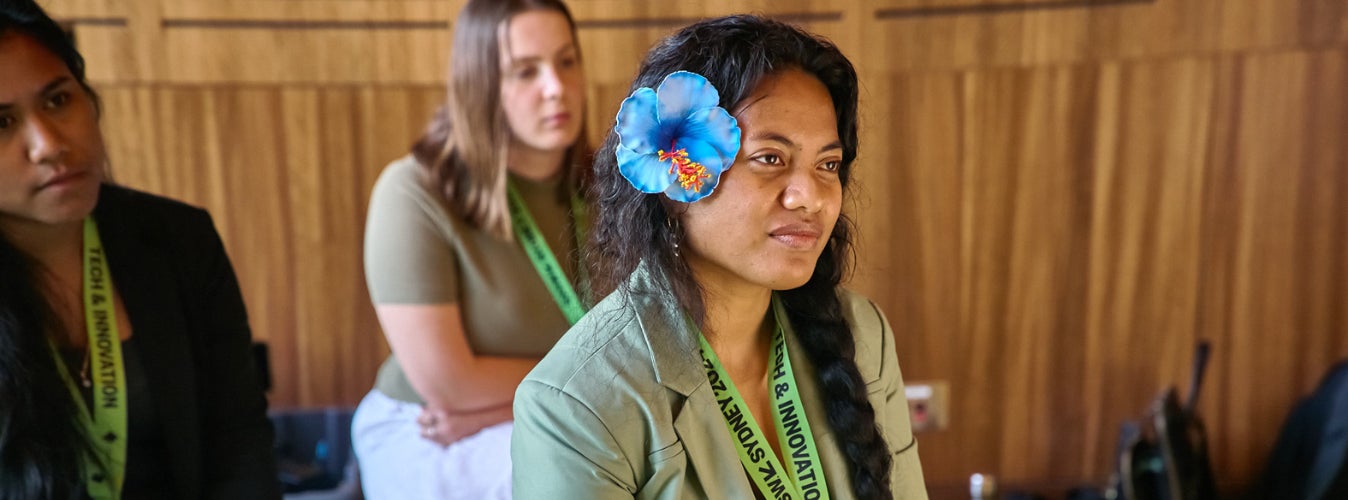 A young Pasifika woman listens to a presentation during SxSW in Sydney.