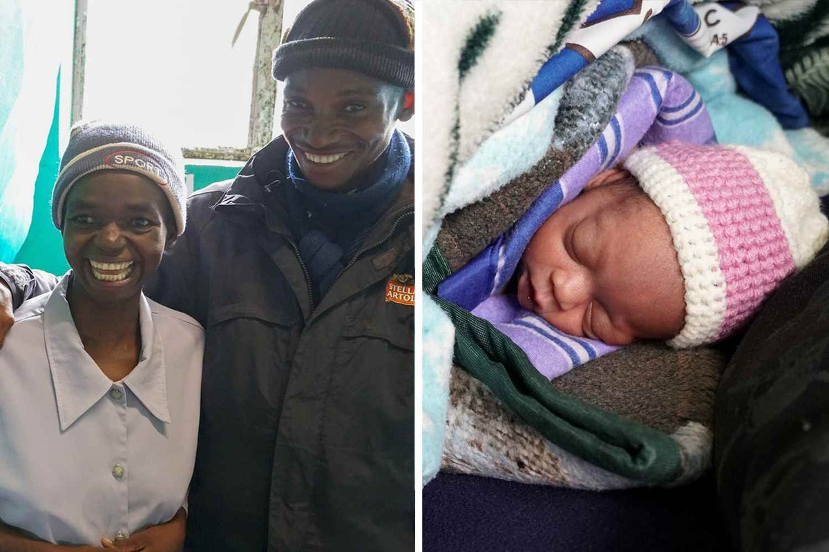 Baby Unity is wrapped up in layers of blankets on the bed, part of a Kangaroo Care program supported by UNICEF.