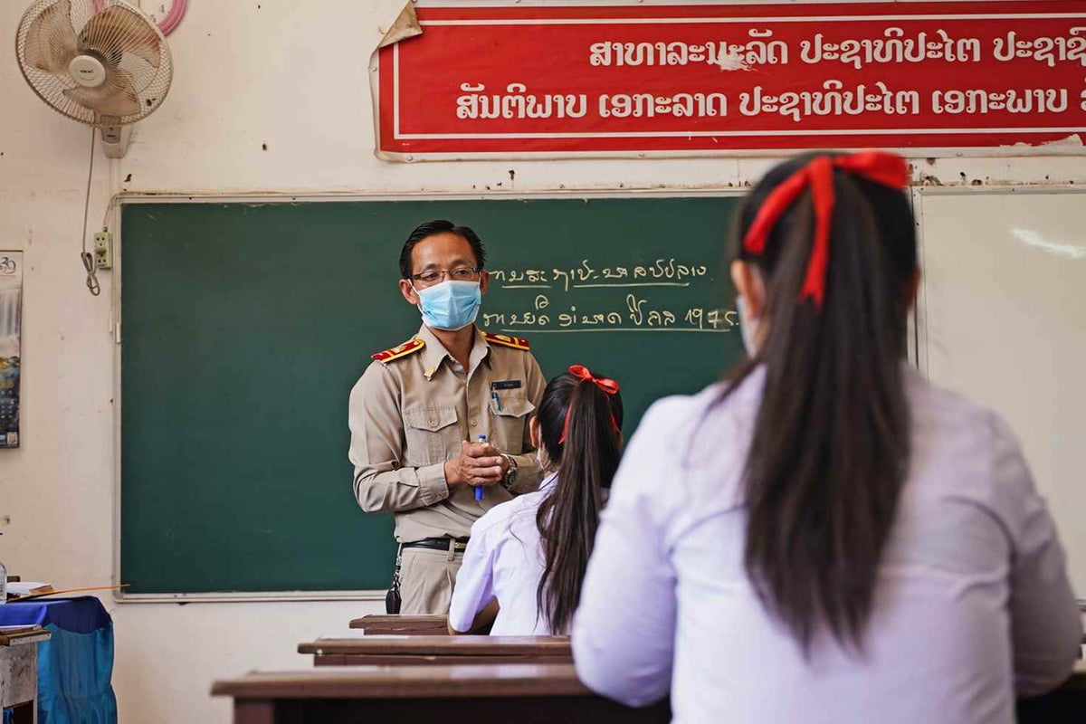 Children learning in a school classroom in Laos.