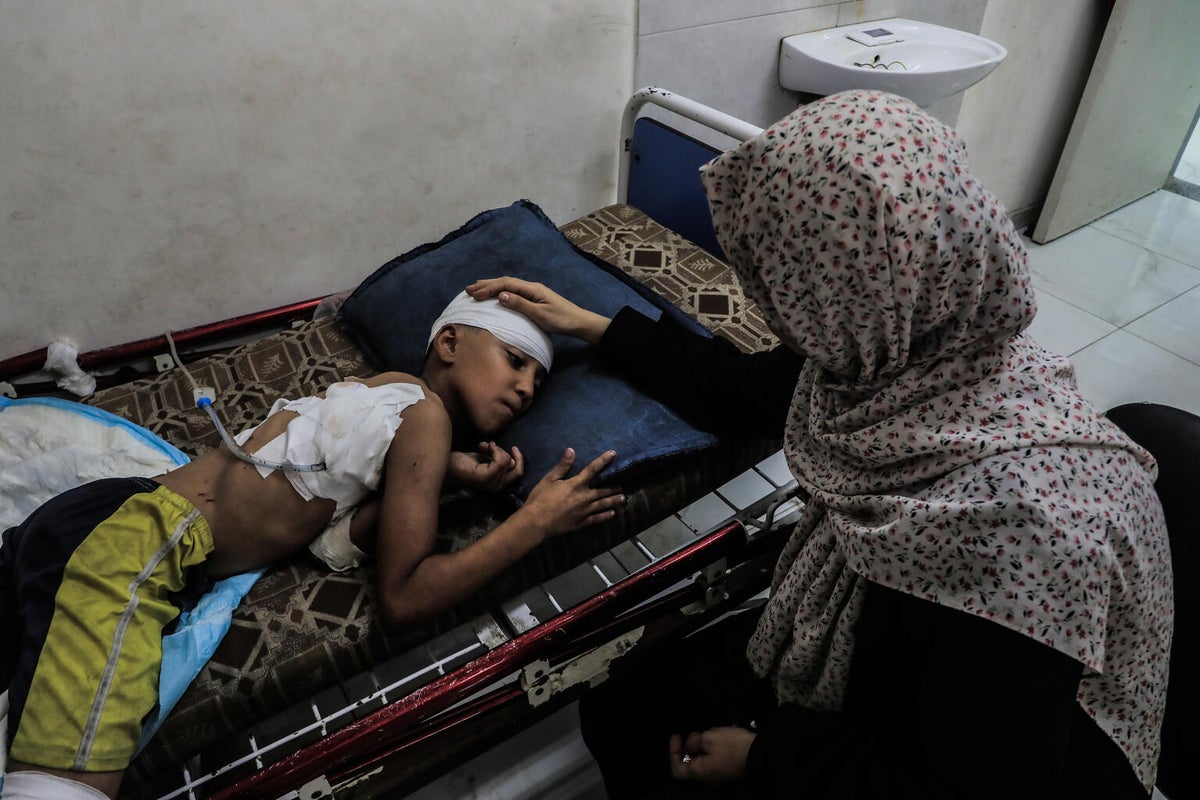 Nine-year-old Mohammed being treated for his injuries after an airstrike in Gaza City.