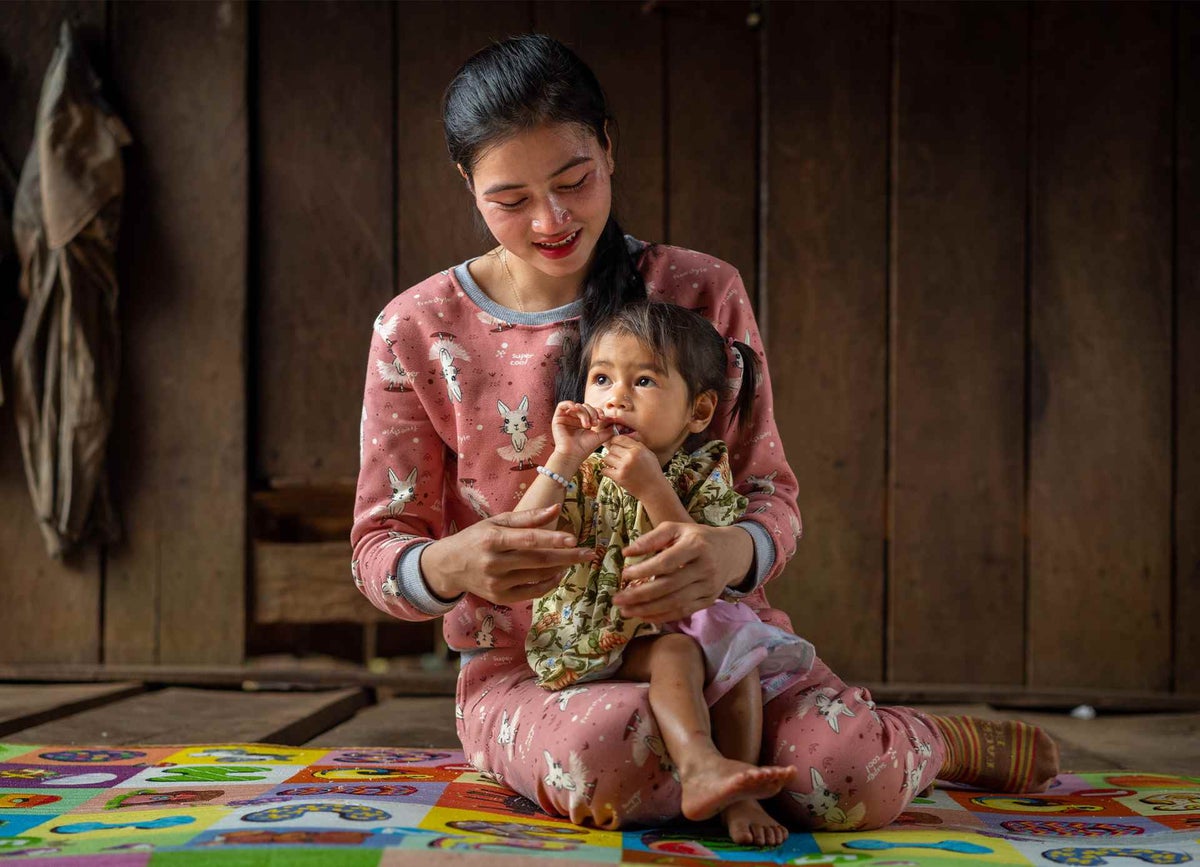 Solina plays with her loving mother when our teams visited, shortly after she was diagnosed with severe acute malnutrition