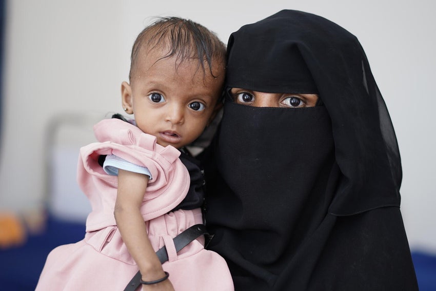 Yemeni mother and daughter looking at the camera