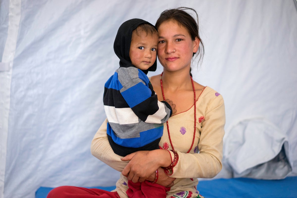 Bimila Dhakune and her son Kris at a hospital in Charikot in Nepal.