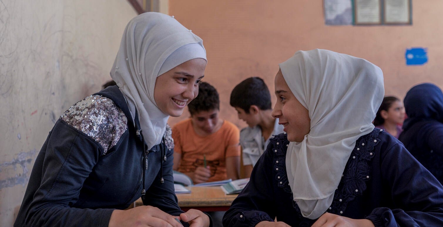 Syrian girls talking and smiling together