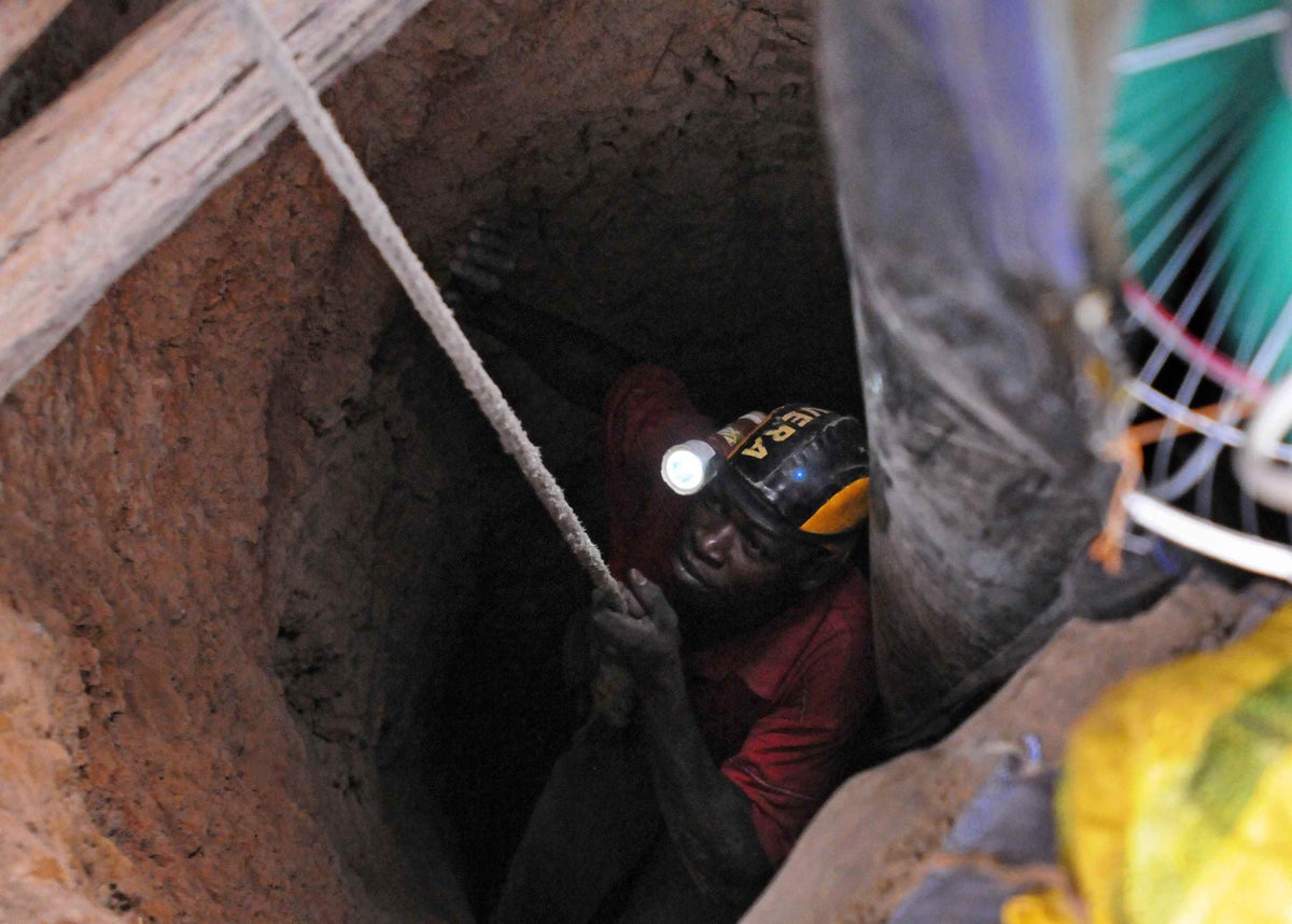 Boureima, teenage boy, is lowered into a mine shaft in Dori, Burkina Faso in 2014.