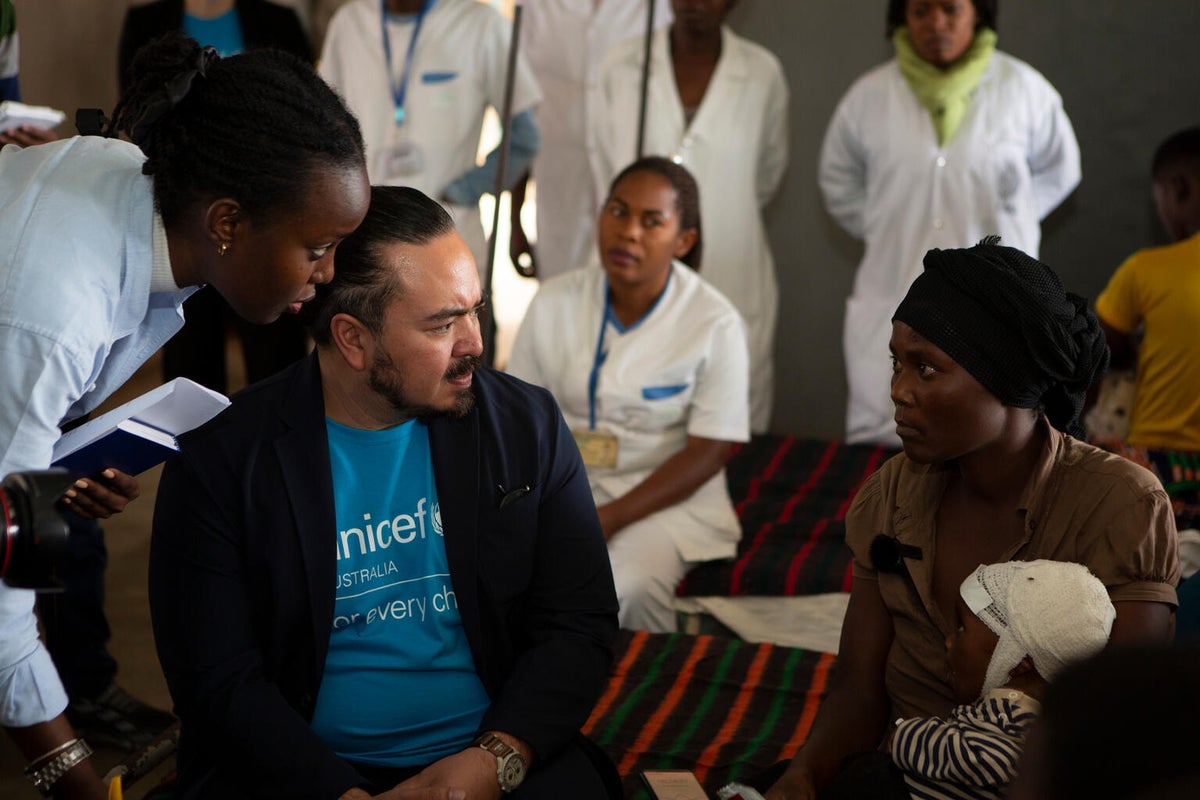 Adam Liaw visiting children in hospital in Burundi, where they are receiving treatment for severe acute malnutrition with ready-to-use therapeutic food.
