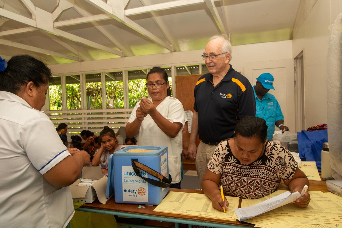 Rotary Project Director James Allen, seeing firsthand the healthcare workers administer the HPV vaccine.