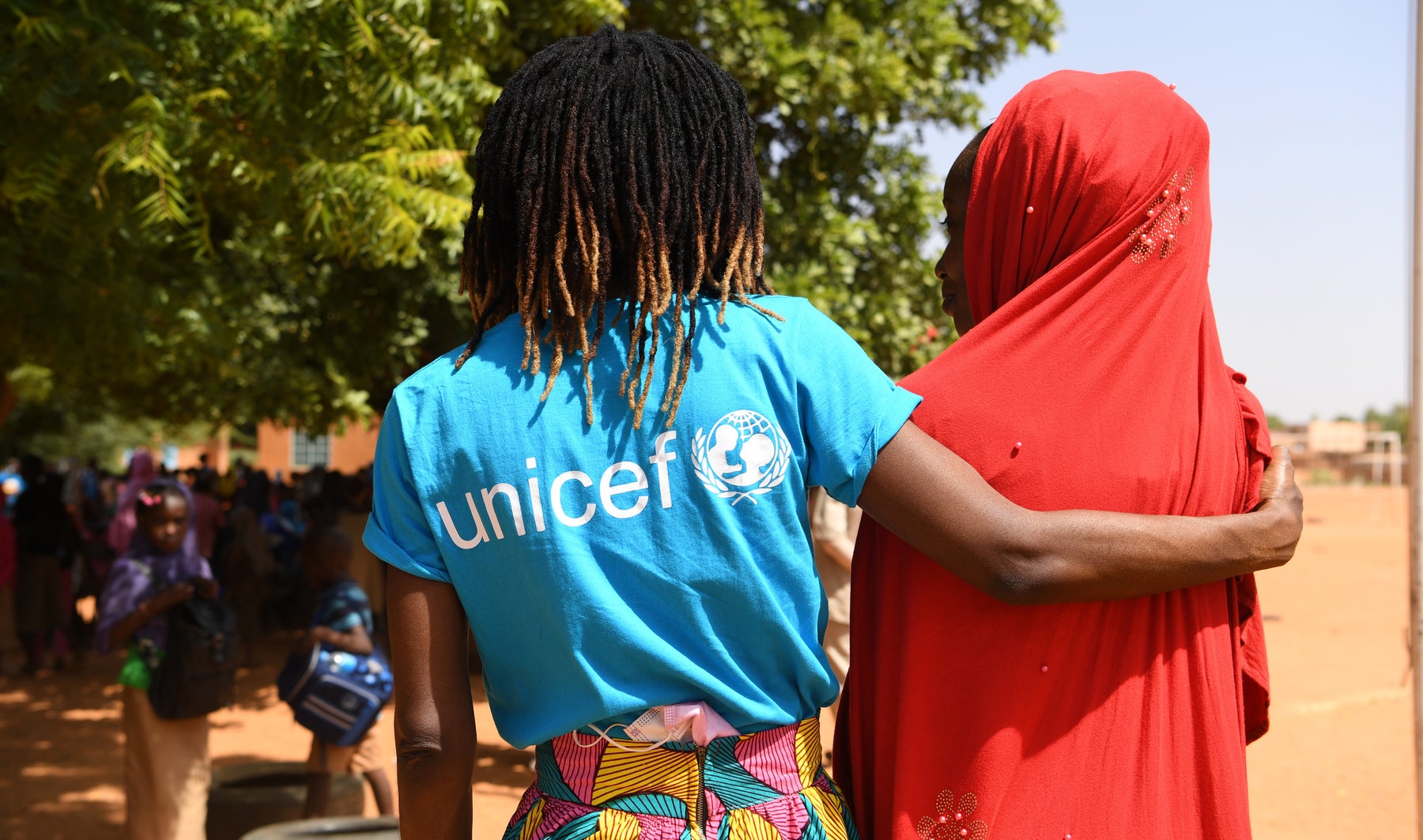 Patricia Safi Lombo, Chief of Education UNICEF Niger, supports a girl at the Yantala school in Niamey, the capital of Niger.