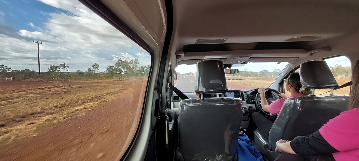 Driving through desert of red sand.