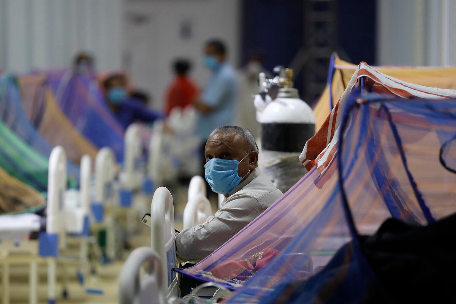 Patients receive treatment in the COVID-19 care centre at the Commonwealth Games Village (CWG) in New Delhi, India.