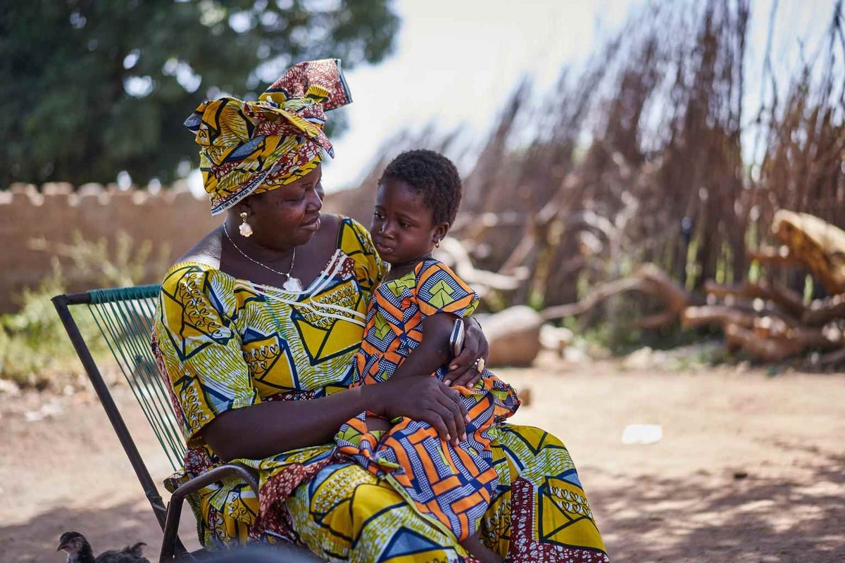 Konimba Keita sits at home with her daughter Bintou in Karangana, Mali, in 2015. Konimba is part of a women's support group that promotes the importance of breastfeeding. 