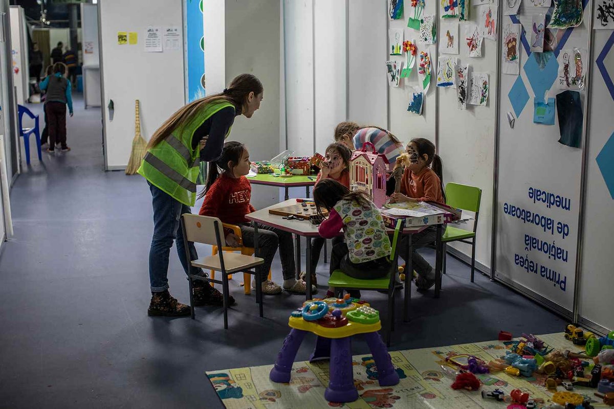 After fleeing war in Ukraine, children draw in an art centre turned into a refugee shelter in Moldova.