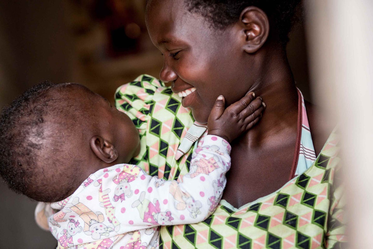 Martha Jere holds her 8 month-old son Rahim at their home in Bilemoni village, Malawi.