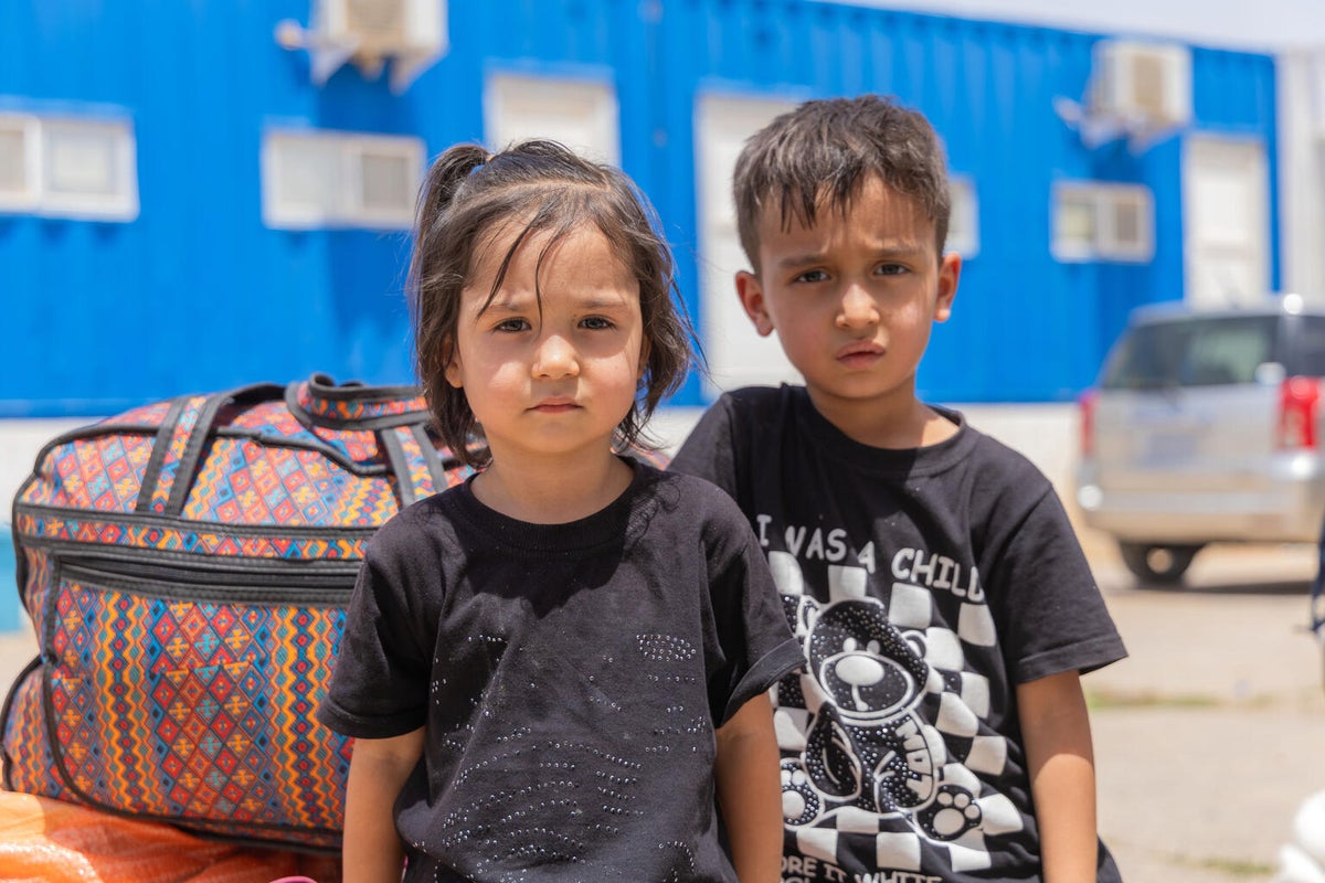 Two children at the border crossing between Iran and Afghanistan