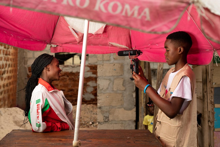 Two young people filming in Congo DRC